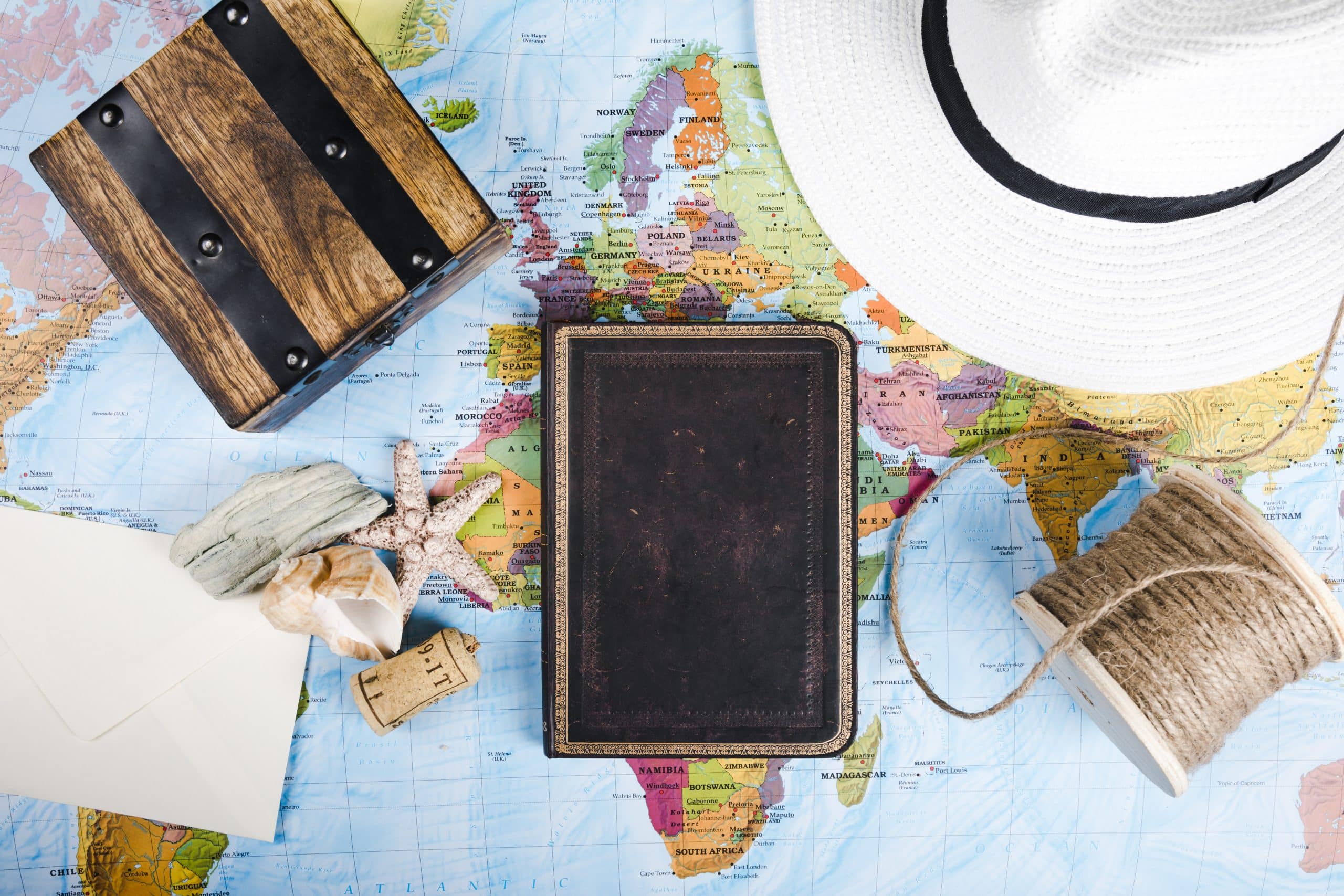 diary sea shell hat wooden box spool world map scaled